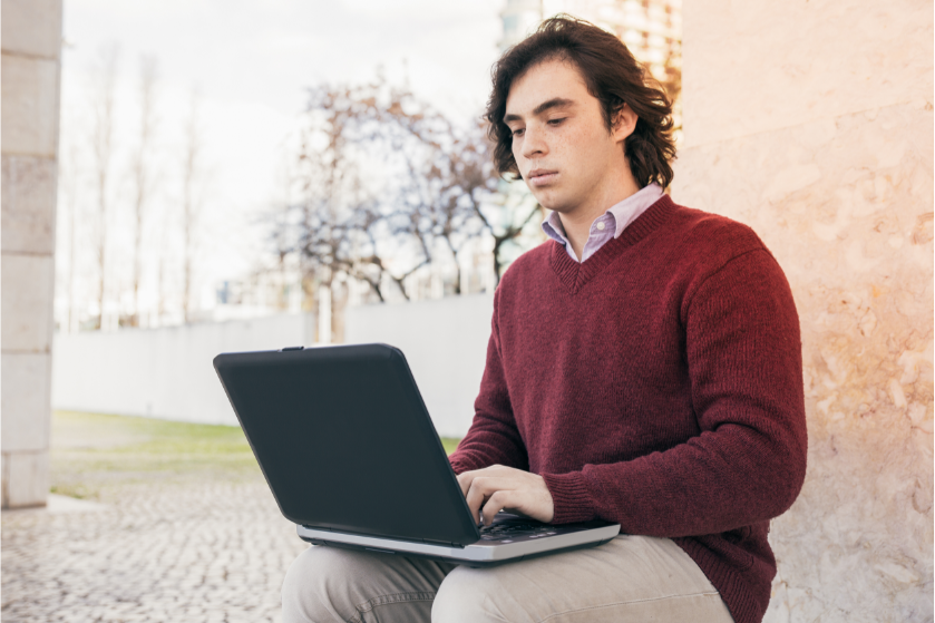 young man laptop 839x559